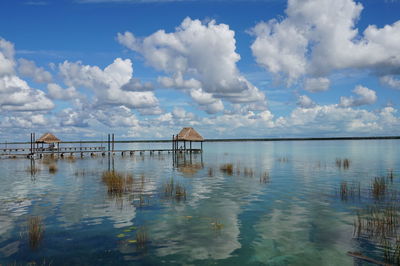 Gazebos in sea against sky