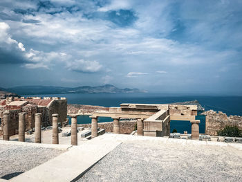 Ancient architecture of greece with a deep sea view. acropolis of lindos.