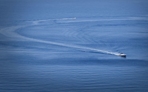 Sailboat in sea against sky