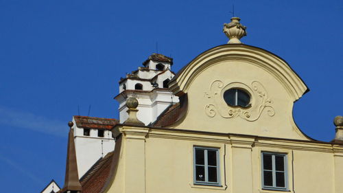 Low angle view of building against blue sky