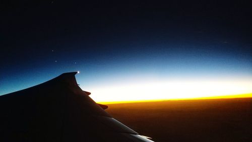 Silhouette of mountain against clear sky