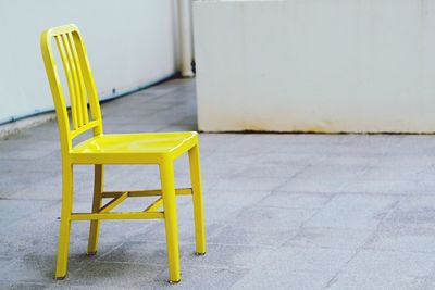 Chairs and table against yellow wall