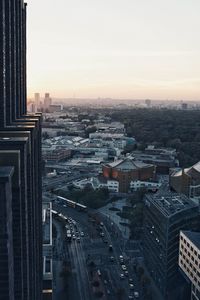 High angle view of city street and buildings against sky