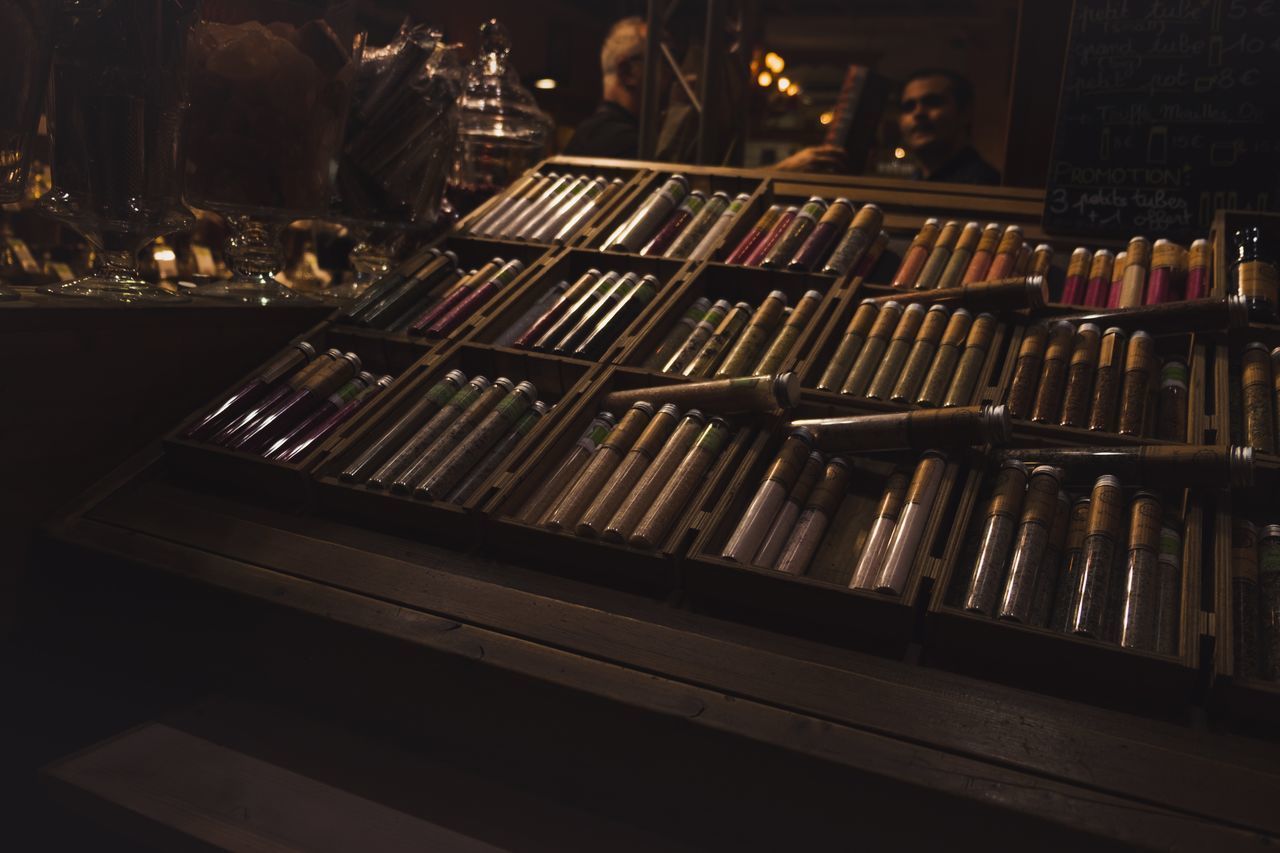 ROW OF BOOKS ON TABLE IN ILLUMINATED ROOM