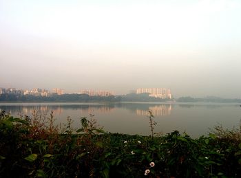 Scenic view of lake against sky during sunset