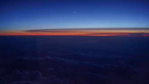 Scenic view of dramatic sky at sunset