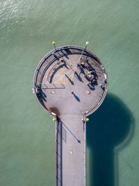 High angle view of metallic structure by sea