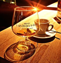 Close-up of wine glasses on table