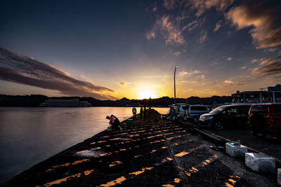 Scenic view of river against sky during sunset