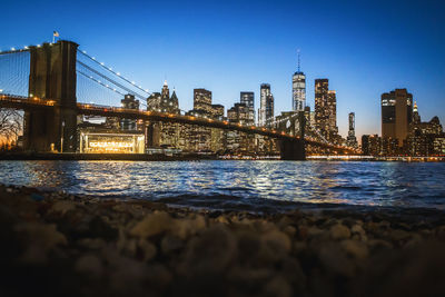 Bridge over river with buildings in background