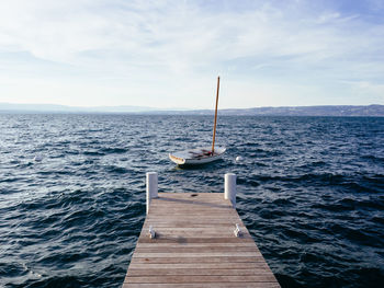 Pier over sea against sky