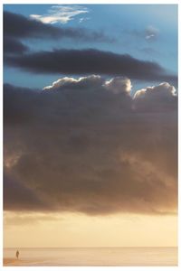 Scenic view of sea against dramatic sky