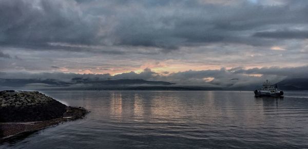 Scenic view of sea against dramatic sky