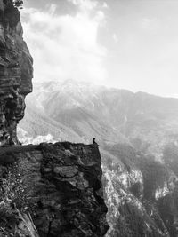 Scenic view of mountains against cloudy sky