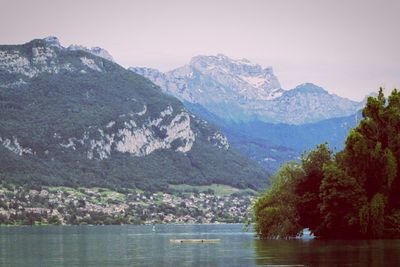 Scenic view of lake and mountains against sky