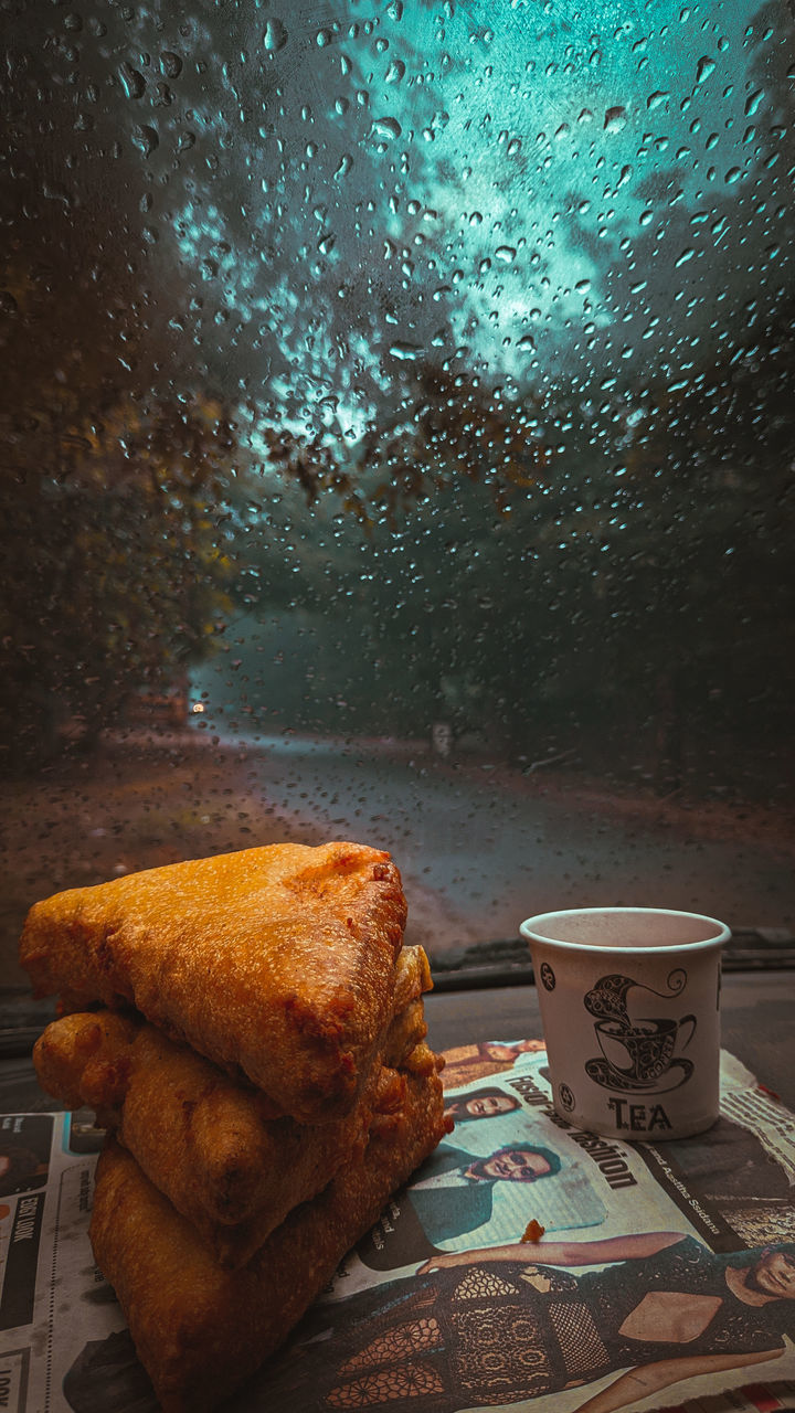 CLOSE-UP OF BREAKFAST ON WET TABLE