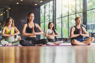 People meditating at yoga center