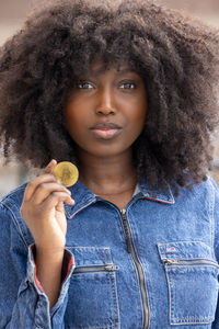 Portrait of young woman with curly hair