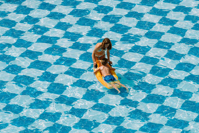 High angle view of woman walking in swimming pool