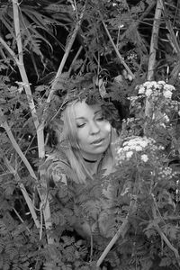 Portrait of woman with plants