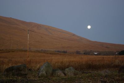 Scenic view of landscape against sky at night