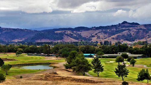 Scenic view of landscape and mountains against sky