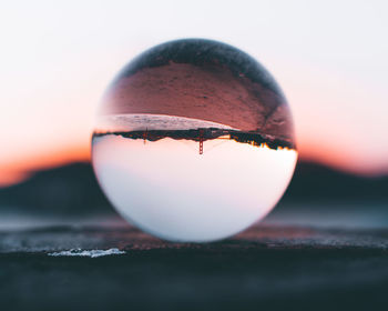 Close-up of crystal ball on table