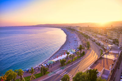 High angle view of city street against sky during sunset