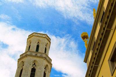 Low angle view of building against blue sky