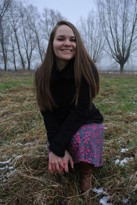 Portrait of a smiling young woman in winter