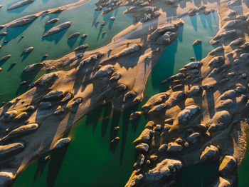 Aerial view of rock formation by river