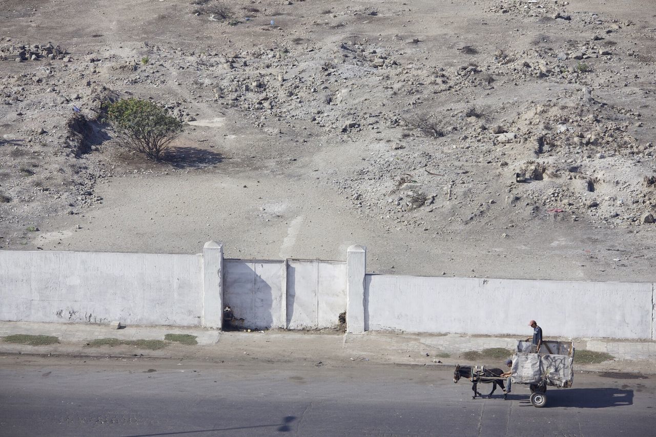 men, transportation, mode of transport, lifestyles, sitting, leisure activity, bicycle, land vehicle, sand, day, street, abandoned, outdoors, person, built structure, beach, full length