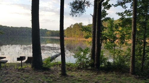 Scenic view of calm lake against sky