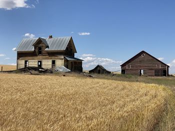 House on field against sky