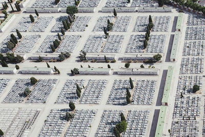 From above aerial drone view shot of cemetery graveyard in the middle of the city