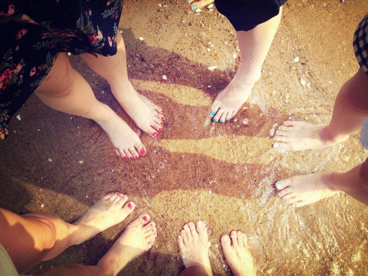 low section, person, lifestyles, leisure activity, togetherness, barefoot, human foot, beach, friendship, standing, bonding, personal perspective, high angle view, men