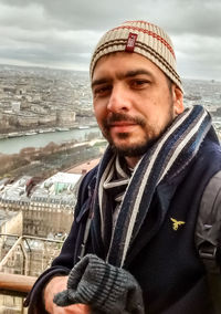 Portrait of man wearing hat against sky