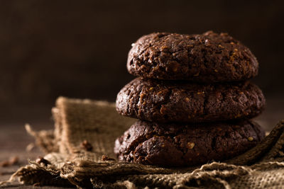 Close-up of stack of cookies against black background