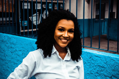 Portrait of a smiling young woman in swimming pool