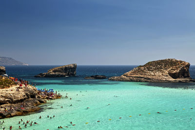 Scenic view of sea against blue sky