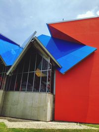 Low angle view of multi colored building against sky