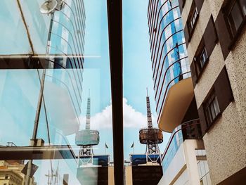 Low angle view of modern buildings against sky