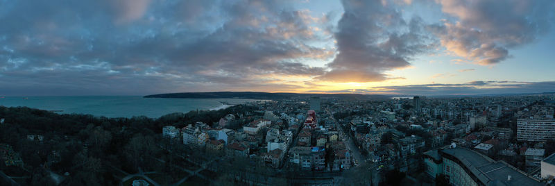 Aerial view of townscape against sky during sunset