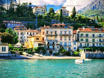 Buildings by river