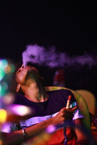 Man exhaling smoke