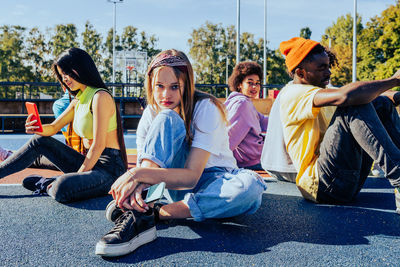 Friends sitting on field