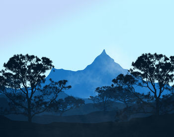 Scenic view of silhouette mountains against clear sky