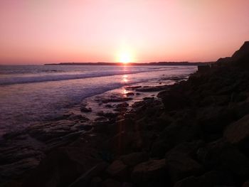 Scenic view of sea at sunset