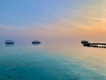 Scenic view of sea against sky during sunrise