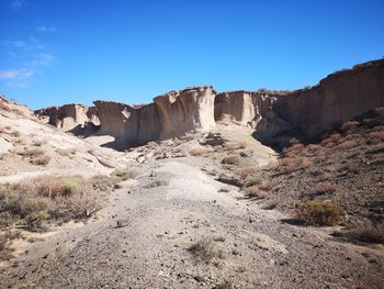 Panoramic view of rocks against clear sky